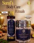 Surul Ayurvedic body care products including oil and powder on a wooden surface with a warm background.